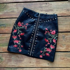 Embroidered faux leather mini skirt